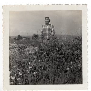 Aladina Cawaling Standing Around Flowers, C. 1960s, Photograph, 3.5 x 3.5 inches, Collection of Cawaling Family