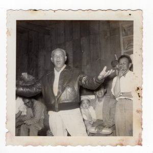 Disgracias Inguillio Singing at a Party, C.1960s, Photograph, 3.5 x 3.5 inches, Collection of Cawaling Family